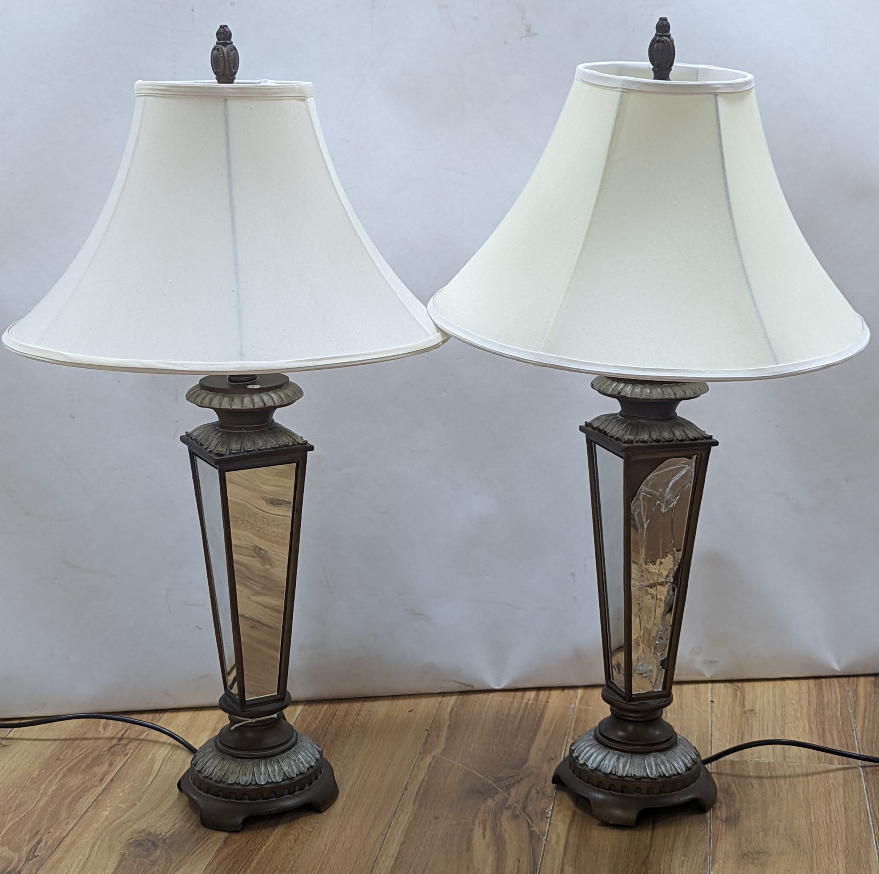 A pair of mirrored bedside lamps, one a/f with shades